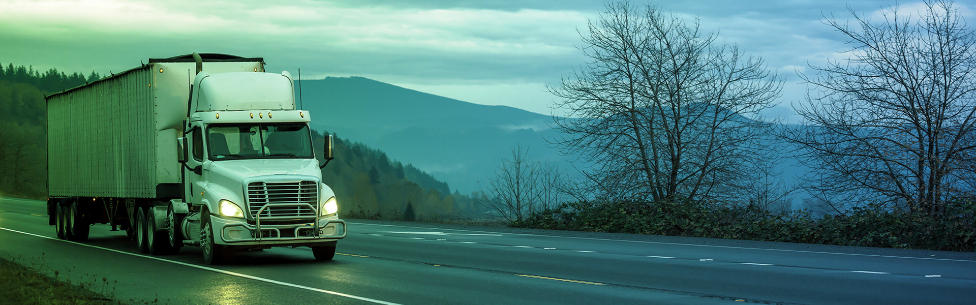 Freight truck on a highway at dusk